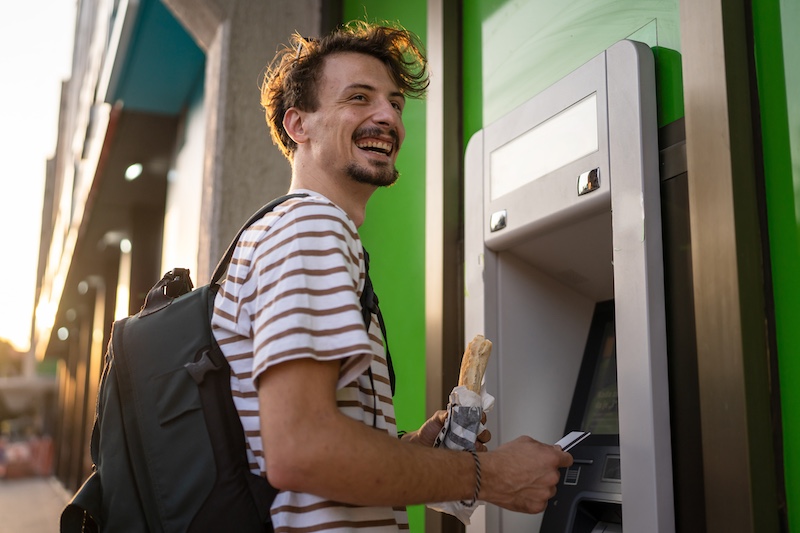 ALT Man using ATM machine